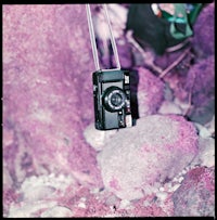 a camera is hanging from a string